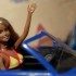 Cali Girl Barbie waves from the front seat of a Chevy SSR du